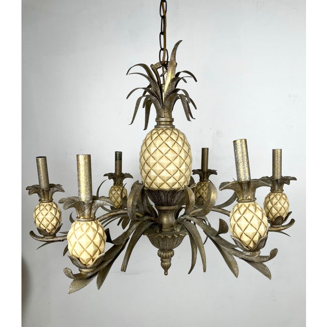 Vintage pineapple tole chandelier. Six arm metal chandelier with large pineapple center and smaller pineapples around....