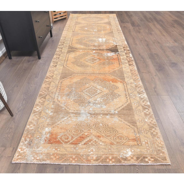 Vintage Turkish Hand-Knotted Tribal Runner Rug is a semi-Vintage rug. '60s Eastern region of Turkey's unique rug is...