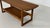 Stylish wooden bench in deep dark brown. The cool, minimalist design contrasts with the warmth of the wood. Understated,...