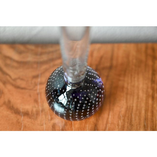 This captivating Murano glass soliflore vase draws the eye from the very first moment: a spherical base of blown glass in...