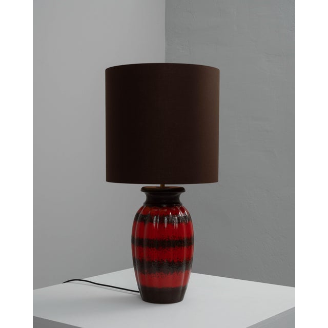 This 20th Century German Ceramic Table Lamp exemplifies the bold and expressive design sensibilities that characterized...