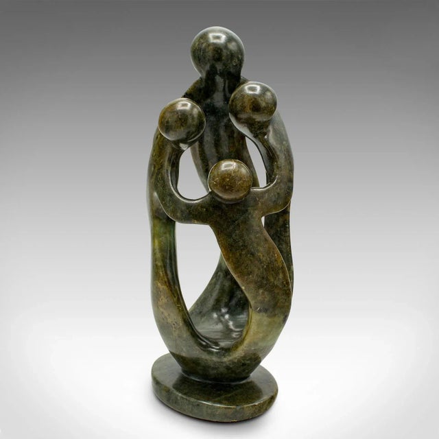 This is a vintage abstract family statue. A tribal African, polished hardstone decorative ornament, dating to the mid 20th...