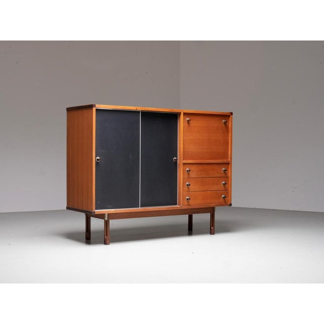 Italian Cabinet / Secretary in Teak, Metal and Black Laminate, 1960s. Versatile and elegant, this 1960s Italian cabinet...
