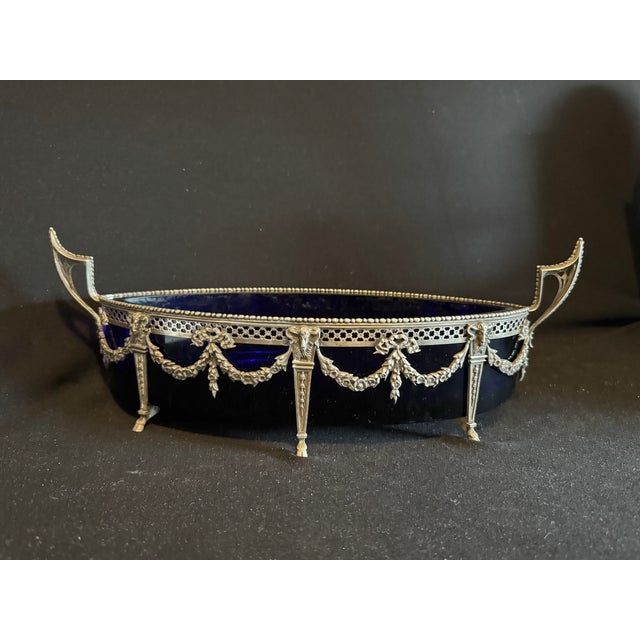 This exceptional 19th century French Louis XVI jardinière bowl embodies elegance, refinement, and timeless artistry....