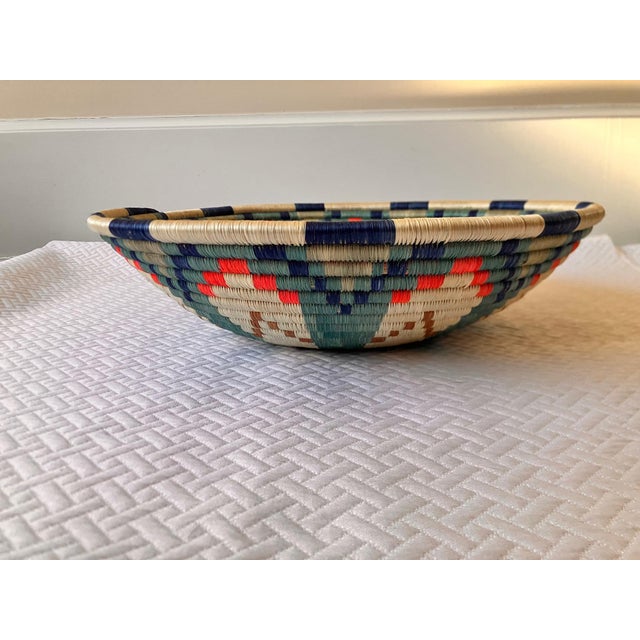 This beautifully hand-crafted, intricately woven basket was made by craftswomen in Rwanda. Made of carefully dyed sisal...