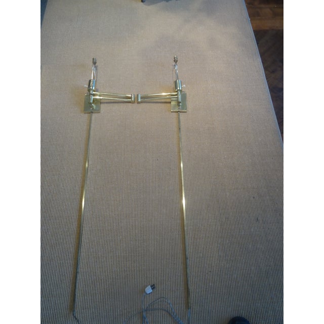 Pair of classic Hansen New York Double Swing Arm Wall Lights Designed by George Hansen in the 1960s-1970s. Manufactured by...