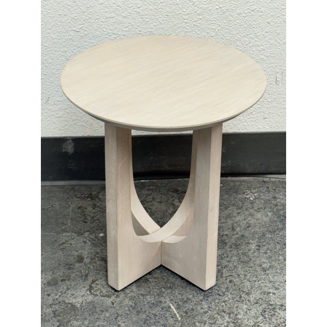 Design Plus Gallery presents a Mac International Wood Side Table. The oval top is supported by a sculptural geometric base...