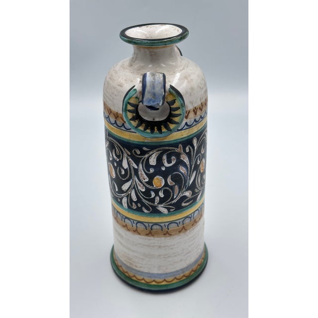 Discover the charm of this exquisite vintage Italian Majolica bud vase, a beautiful piece crafted by Castelli for Cottura....