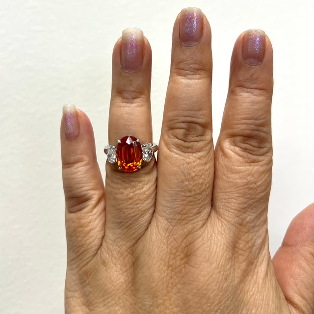 Gorgeous bright orange 7.79 ct. Mandarin garnet oval with 1.20 ct. GH VS-SI white diamond ovals. Handmade in platinum....