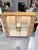 A refined modern display cabinet defined by its clean architectural lines and warm oak exterior. The full glass doors...