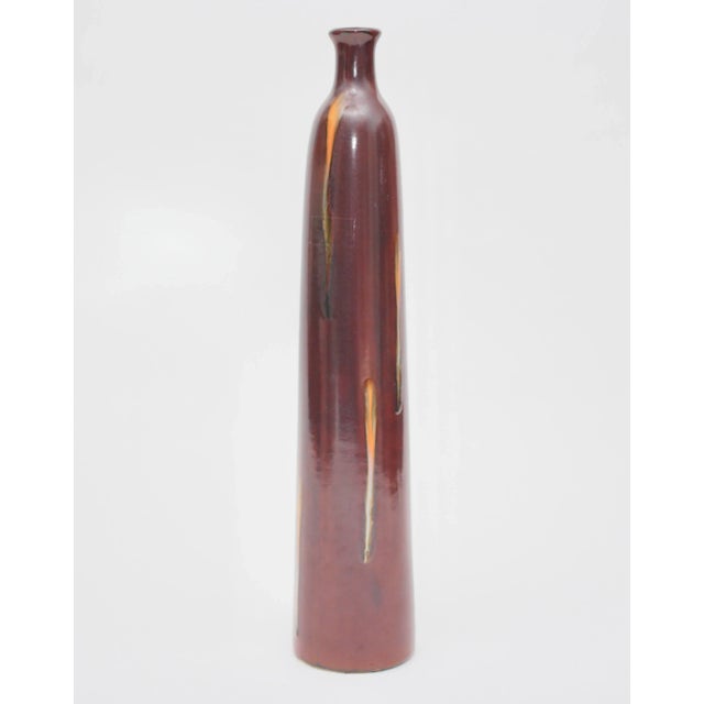 Strikingly simple 18" tall Lava Glaze Studio Pottery vase with an organic textured quality. Marked and numbered on bottom.