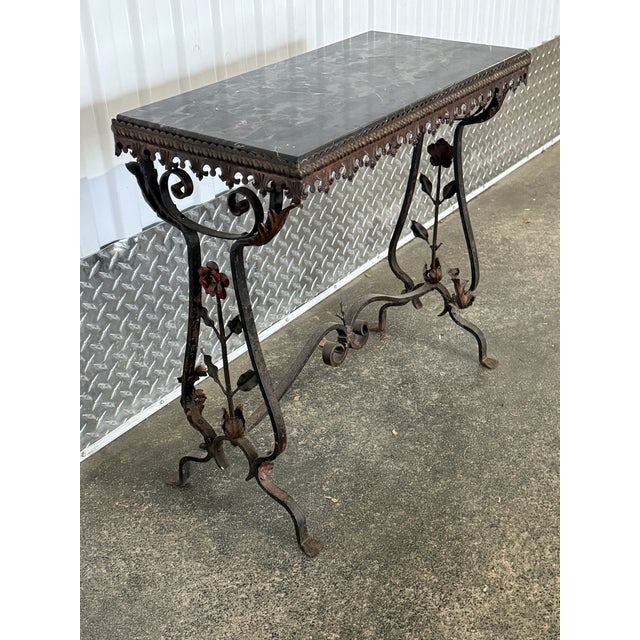 1920"s Black Marble Wrought Iron Table W Flowers sold as found in good condition showingnoraml signs of sue for its age,