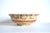 An antique, mid-19th-century large, heavy spongeware mixing bowl in a tan base with brown stripes and brown and blue...