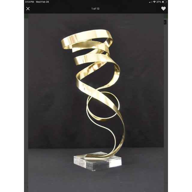 Beautiful flowing movement in this Dan Murphy "Ribbon" sculpture on a 6.5" x 6.5" Lucite base.