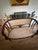 Elegant vintage Victorian-style settee featuring a beautifully shaped dark mahogany-toned wood frame with graceful curved...