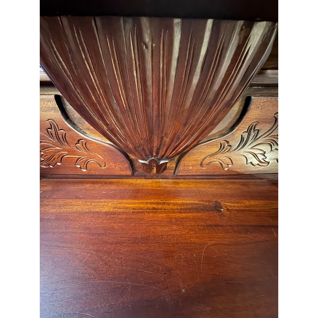 An elegant late Victorian Eastlake hall tree crafted in richly toned mahogany, featuring a beautifully carved...