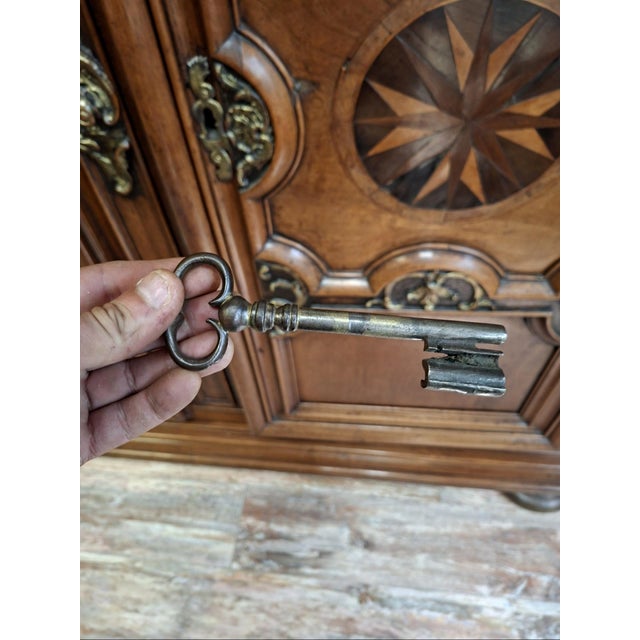 Louis xiv walnut wardrobe, richly molded and inlaid – 18th century this substantial solid walnut wardrobe, with two doors,...