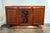 Sculptural, French Art-Deco, marble-top sideboard with lovely carved birds and flowers design on central door flanked by...