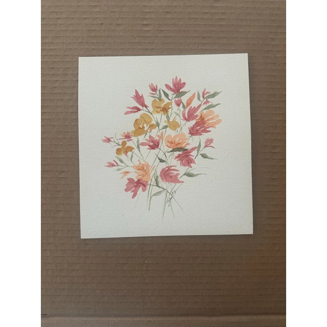 A romantic cascade of pink, coral, and ochre flowers dance across the page in this airy, elegant floral composition. Ideal...