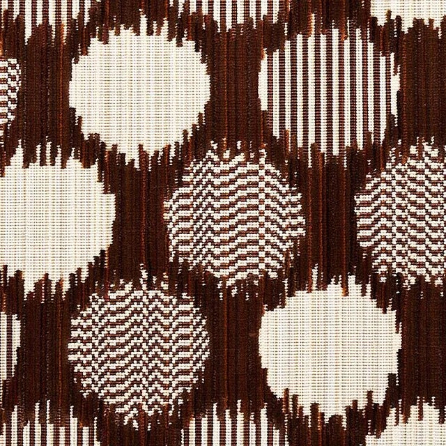 A medley of yarns and a complicated weave structure create the striated effect of this sophisticated dot pattern. Textured...