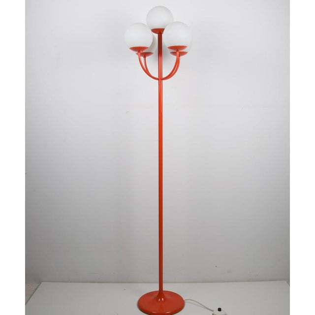 Mid-century four-light floor lamp by kaiser leuchten, germany, 1960s. The lamp features a vivid red lacquered metal...