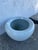 White porcelain fishbowl style Jardinere. Stylish addition for indoor plants. Incurving rim (lip) at the top helps keep...