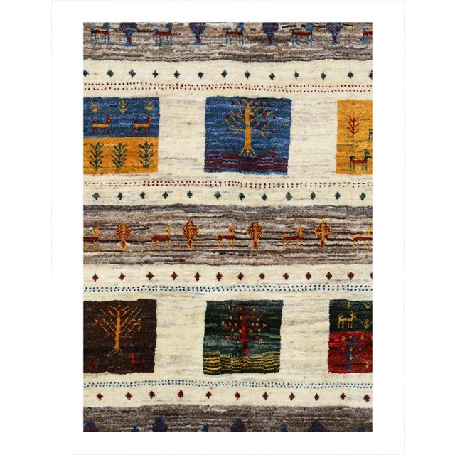 The word Gabbeh translates closely to unfinished or unclipped. Originally these rugs were woven for the weavers use with...