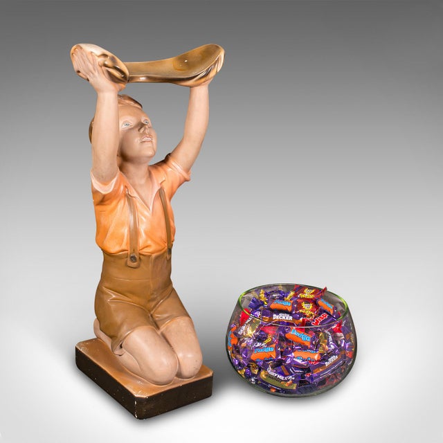 This is a vintage shop retail display character. An English, plasterwork decorative merchandising figure, dating to the...