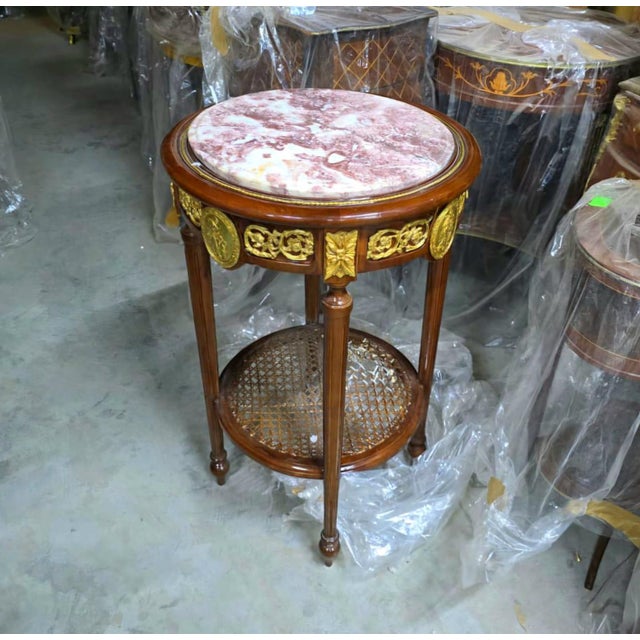 Introduce timeless French sophistication into your home with this exquisite Louis XVI-inspired side table, masterfully...