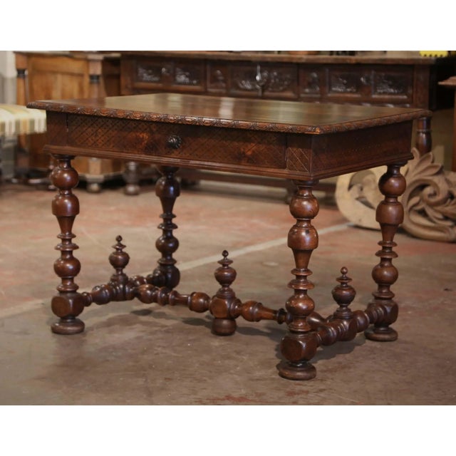 Incorporate extra, functional surface space into your living room or den with this elegant antique side table. Crafted in...