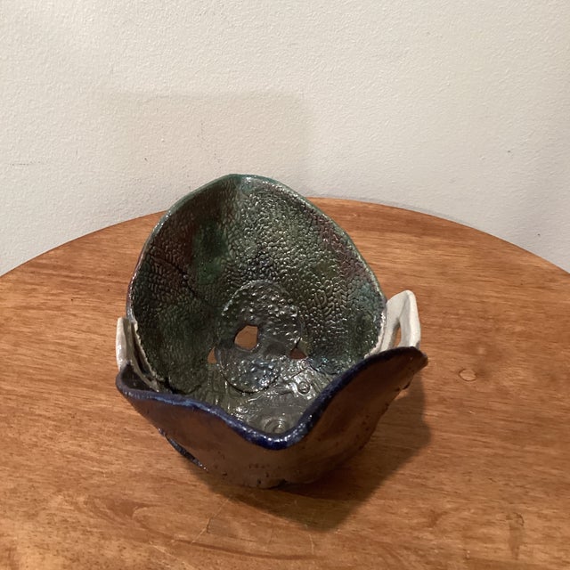 This handcrafted stoneware bowl features a unique multi fired finish with a raku glaze, creating an eclectic and vintage...