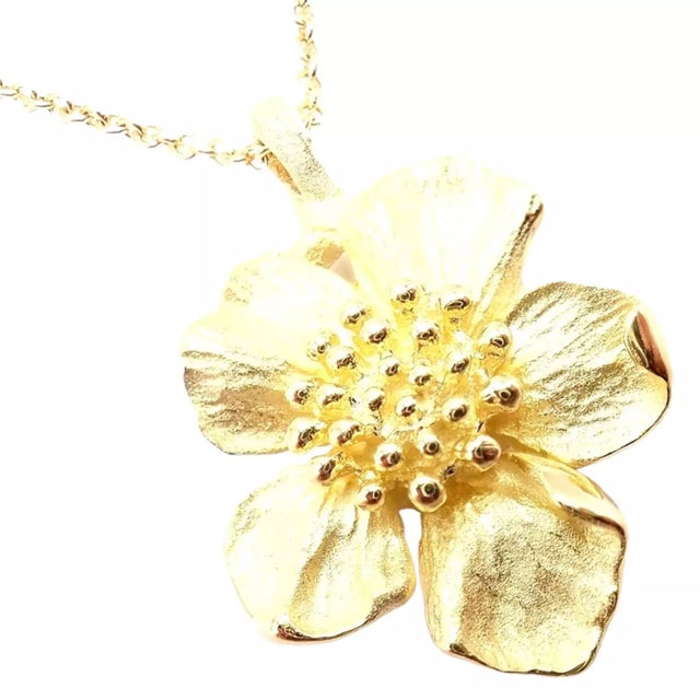 Vintage Tiffany & Co. 18K Yellow Gold Dogwood Flower Pendant Necklace Details: Metal: 18k Yellow Gold Length: 16" Weight:...