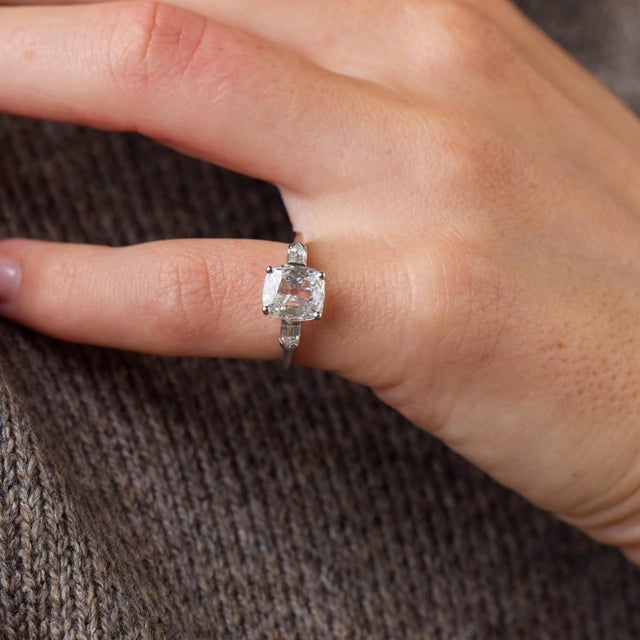 This extraordinary Art Deco engagement ring is a beautifully refined jewel from the 1930’s, centered by a GIA-certified...