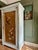 Vintage painted armoire, we have added a chinoiserie door panel depicting birds and flowers. Hanging rail and lock and...