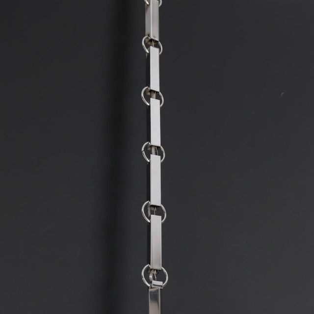 Sculptural Italian Modernist sixteen light chandelier. Chromed metal finish with sixteen candelabra base sockets. Features...