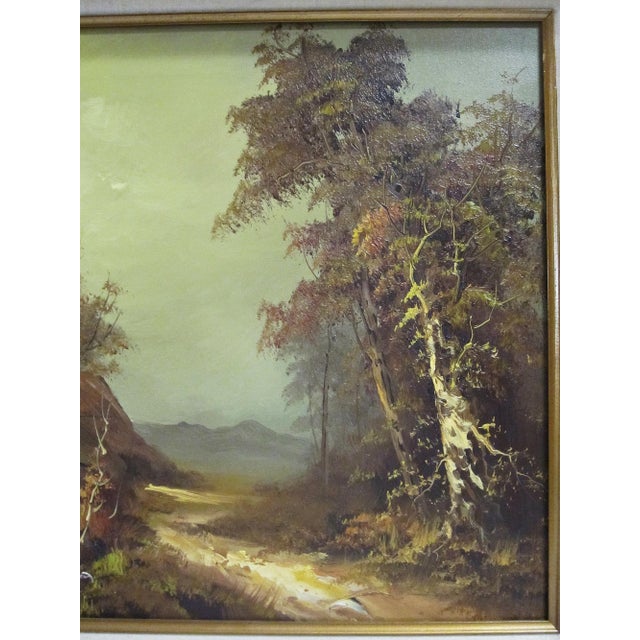 A signed vintage oil on canvas landscape painting featuring a quiet cottage scene with a winding path, mature trees, and...