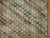 Distressed room-size Turkish deco rug with a repetitive square design throughout in multiple colors, predominantly in...