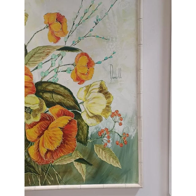 Large framed vintage oil painting on canvas of Hibiscus flowers. Signed lower right Danniele. Frame s made from faux bamboo