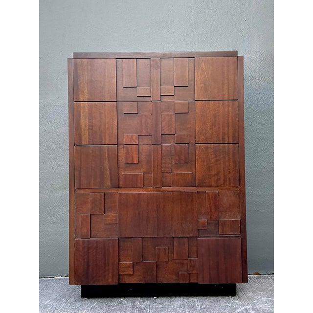 Experience the architectural grandeur of the 1970s with this iconic "Staccato" tall chest of drawers by Lane. Heavily...