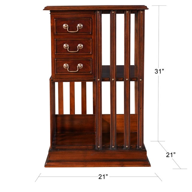 A Leather Top Revolving Bookcase from Niagara Furniture with full grain leather top with a shaped molding surround, over...