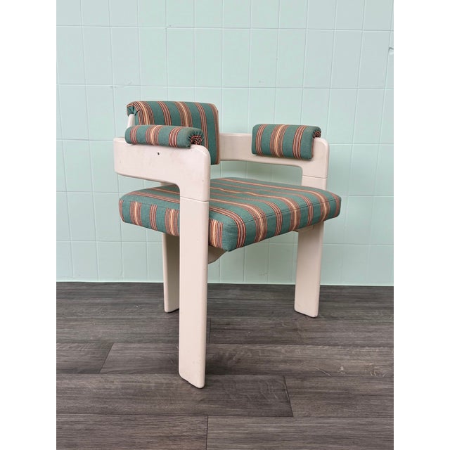 This armchair features a vintage style influenced by 1970s design. It features a solid geometric frame and colorful...