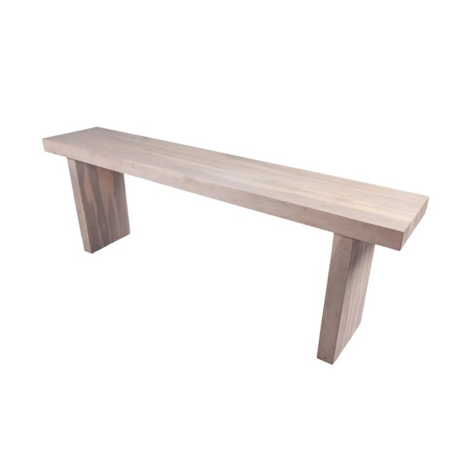 Built with reclaimed teak wood, this modern console table with simple linear planes is sanded by hand to leave the wood...