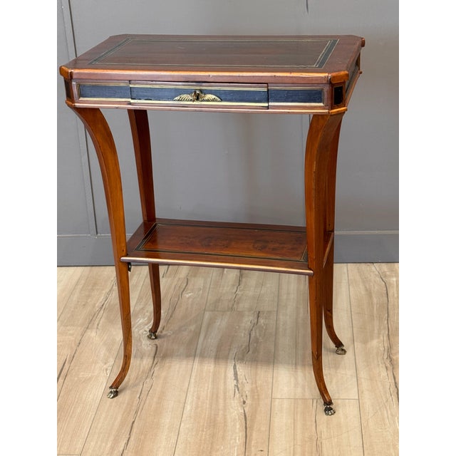 Continental, probably Northern European, Neoclassical inlaid mahogany side table, the rectangular top with canted corners...