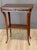 Continental, probably Northern European, Neoclassical inlaid mahogany side table, the rectangular top with canted corners...