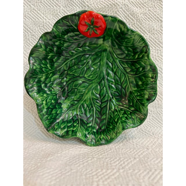 This majolica leaf bowl is the perfect touch of whimsy for your collection as it has an added bonus of a bright red tomato...