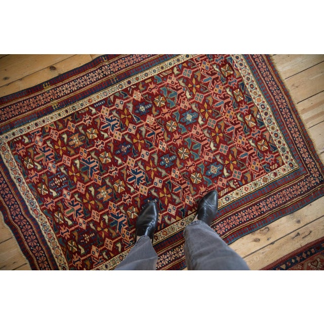 :: Colorful antique Seichour with pinwheel floral designs and bud cross sections in-between long stemmed vines bearing...