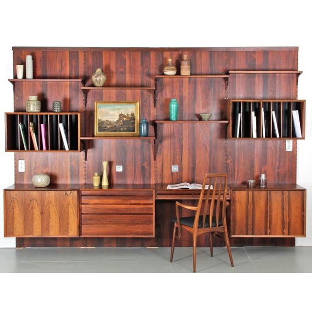 Rosewood Wall Shelving Unit by Poul Cadovious for Cado, 1960s, in Good conditions. Designed 1960 to 1969 This piece is...