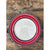 This vintage Italian serving plate is a study in bold, concentric banding. A broad, flat rim in saturated tomato red is...