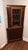 This is an antique English Georgian corner curio cabinet display case, designed to hold and showcase curios and decorative...