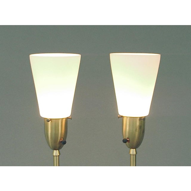 The designers of these lamps certainly were tuned into the spirit of their moment! The decorated elements positively exude...